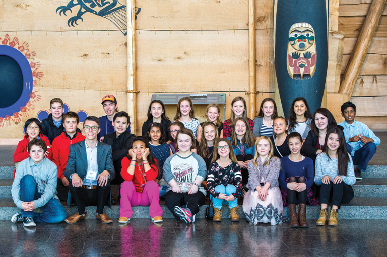 Colour photograph of students posing at the Canadian Museum of History. Photo: Brittany Gawley Photography
