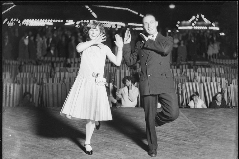 Black and white photo of a couple dancing during the 1920s.