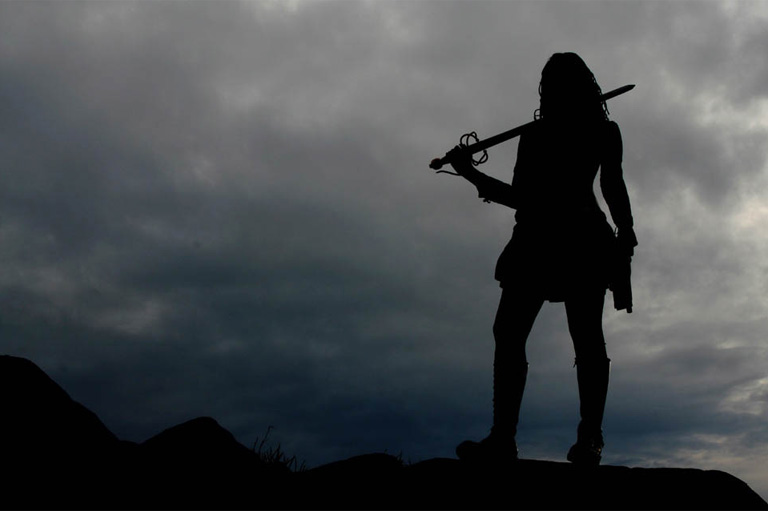 Silhouette of a swordswoman